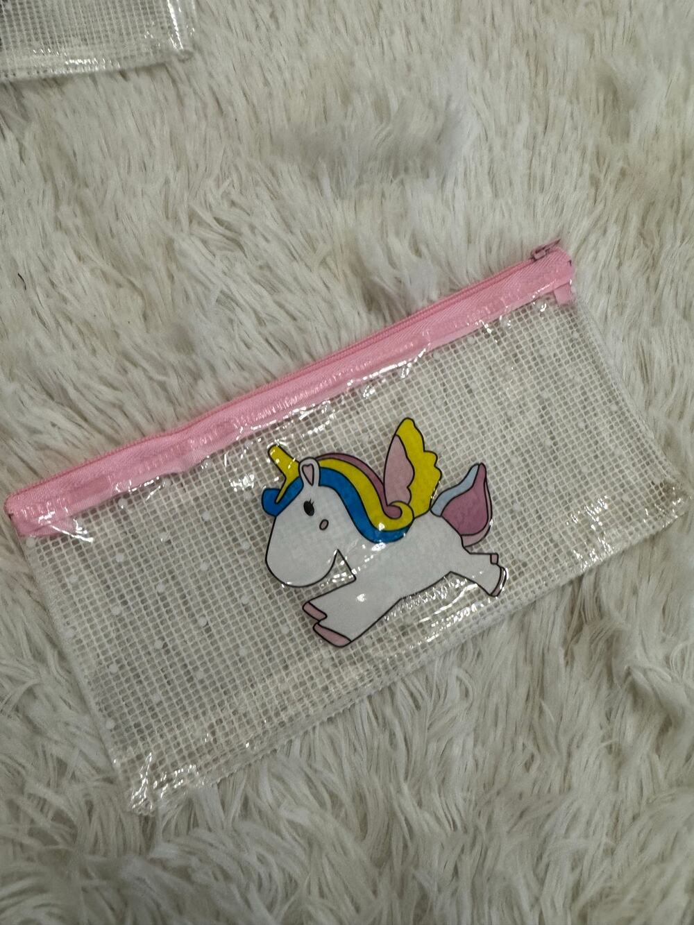 Clear unicorn pencil case with pink zipper and white unicorn with rainbow